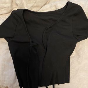 Short sleeve, cropped top that ties in the front